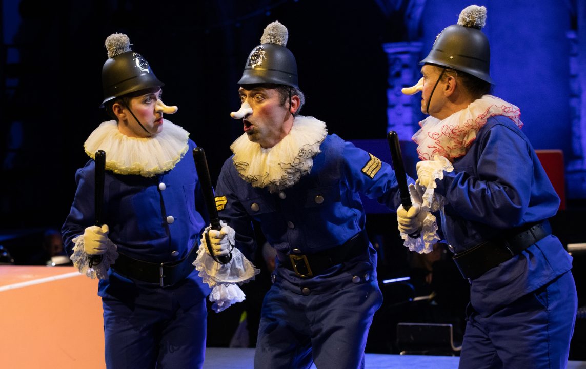 Trevor Eliot Bowes as Sergeant of Police with members of the Opera Holland Park Chorus in The Pirates of Penzance at Opera Holland Park, 2021 © Ali Wright