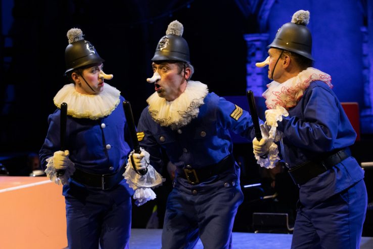 Trevor Eliot Bowes as Sergeant of Police with members of the Opera Holland Park Chorus in The Pirates of Penzance at Opera Holland Park, 2021 © Ali Wright